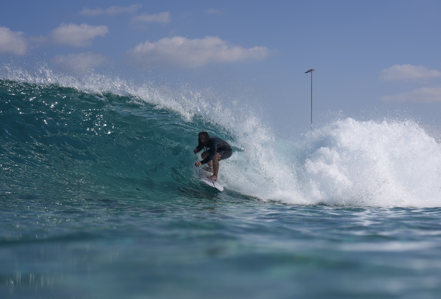 Siôn Jones surfing a wave